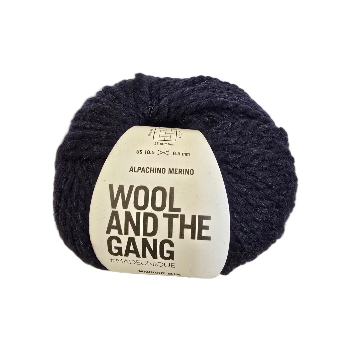 Image of a single ball of Alpachino Merino Yarn by Wool And The Gang in the color Midnight Blue with label on a white background.