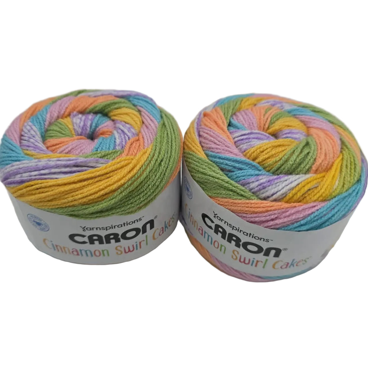 Image of two cakes of Caron Cinnamon Swirl Cakes Yarn in the color Sugar Mint with labels on a white background.