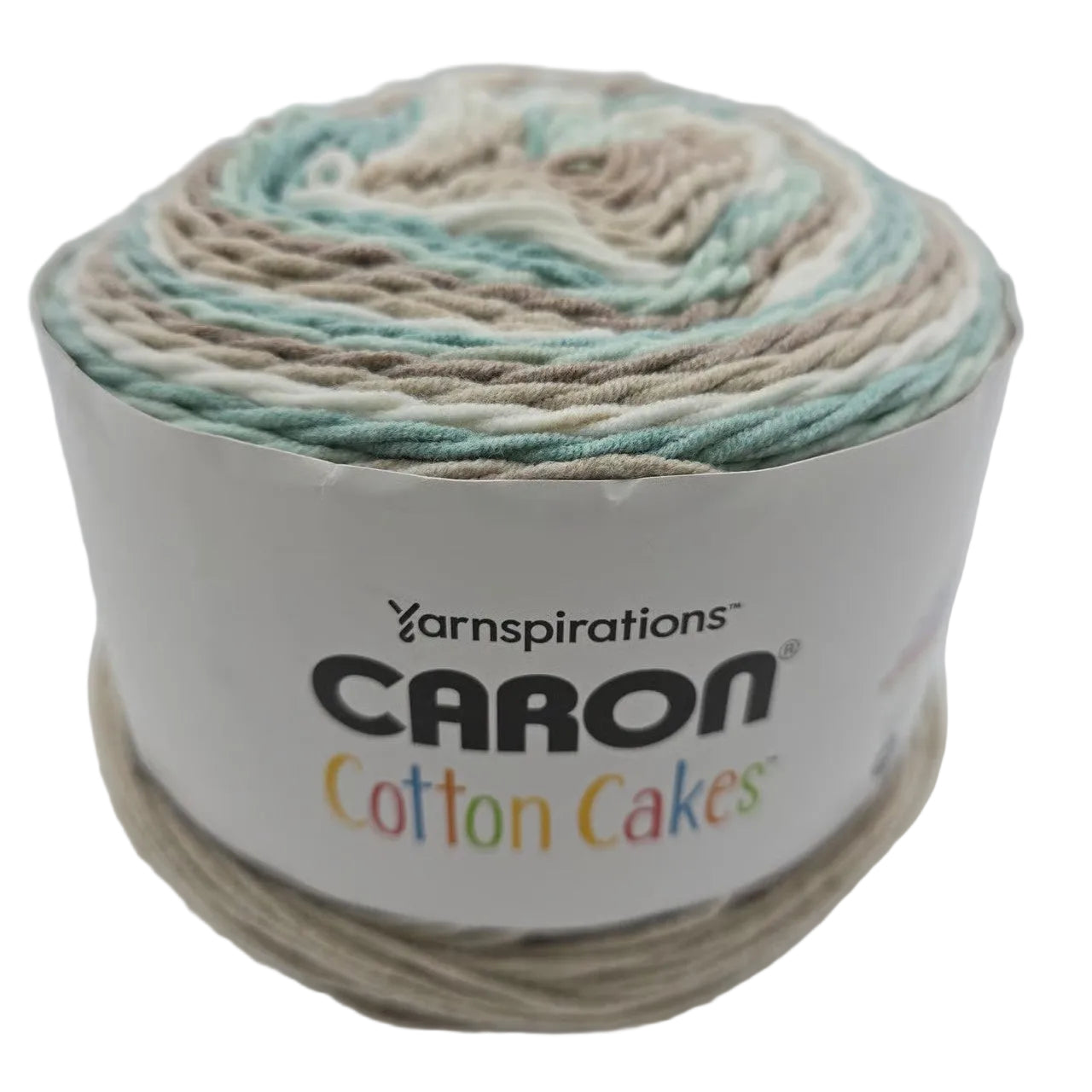 Image of a single cake of Caron Cotton Cakes yarn in the color Beachglass with label on a white background.