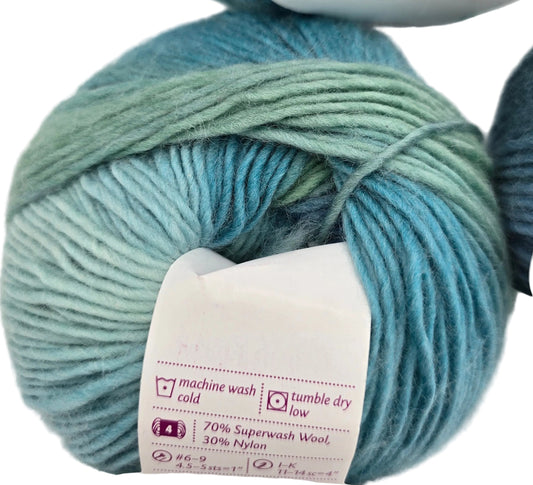 Close-up Chroma Worsted Weight Yarn by Knit Picks in the color Surf's Up with partial label and white background.