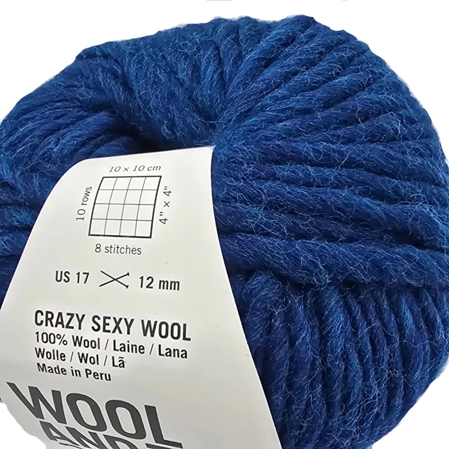 Close-up Image of a single ball of Crazy Sexy Wool Yarn by Wool And The Gang in the color Curasao Blue with label on a white background.