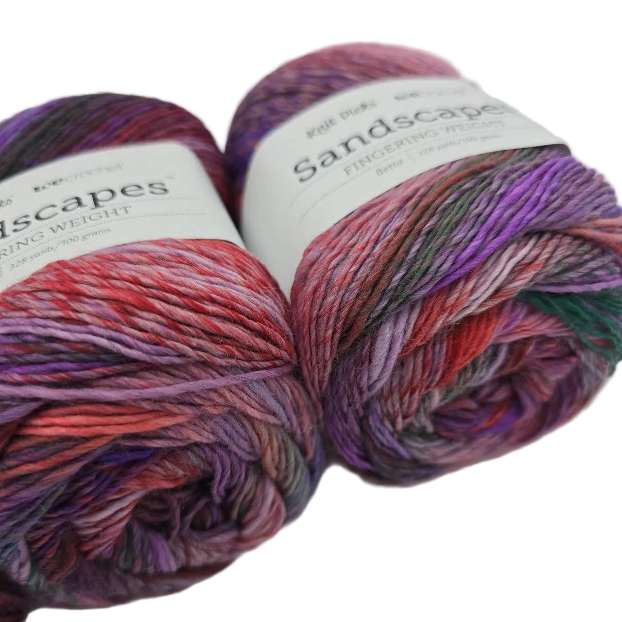 Close-up image of Sandscapes yarn by Knit Picks in the color Betta with labels on a white background.