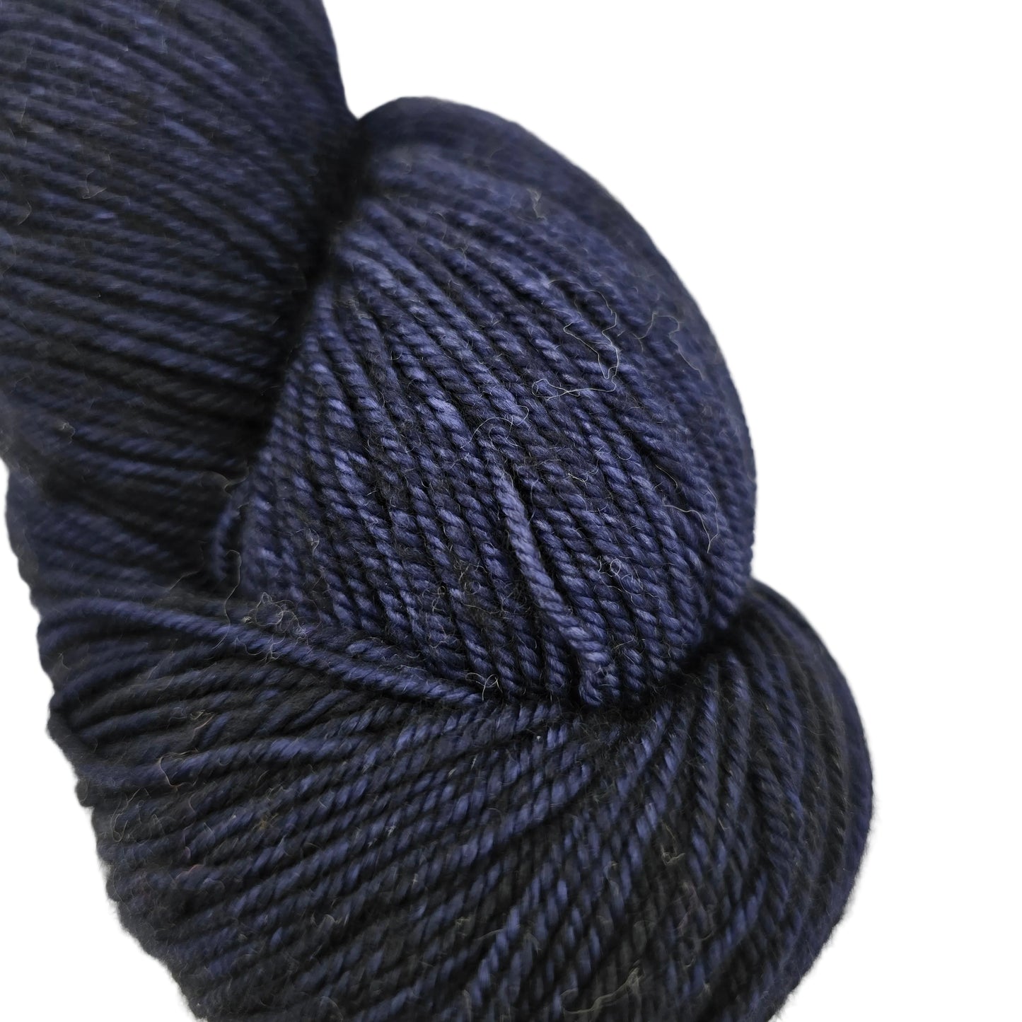 Close-up image of Sock by Malabrigo Yarn in color 807 Cote de Azure on a white background.