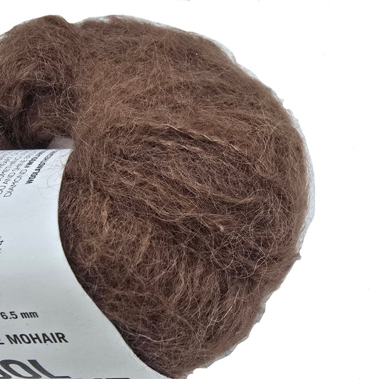 Close-up Image of a single ball of Take Care Mohair Yarn by Wool And The Gang the color Chocolate Brown with label on a white background.