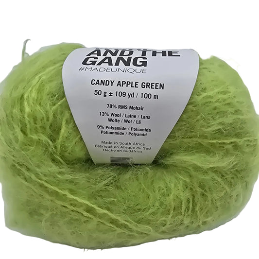 Close-up Image of a single ball of Take Care Mohair Yarn by Wool And The Gang in the color Candy Apple Green with label on a white background.