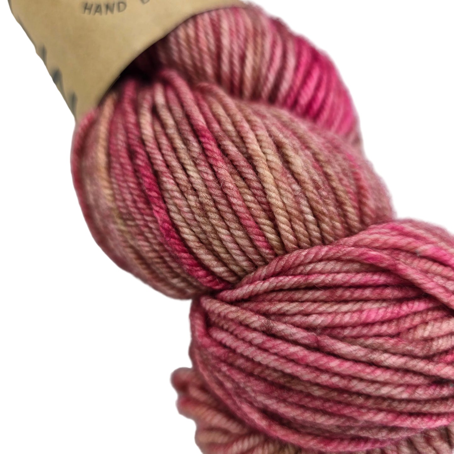 Close-up image of Tosh_Vintage_Yarn_by_Madelinetosh_in the color _Fragrant with partial label on a white background.