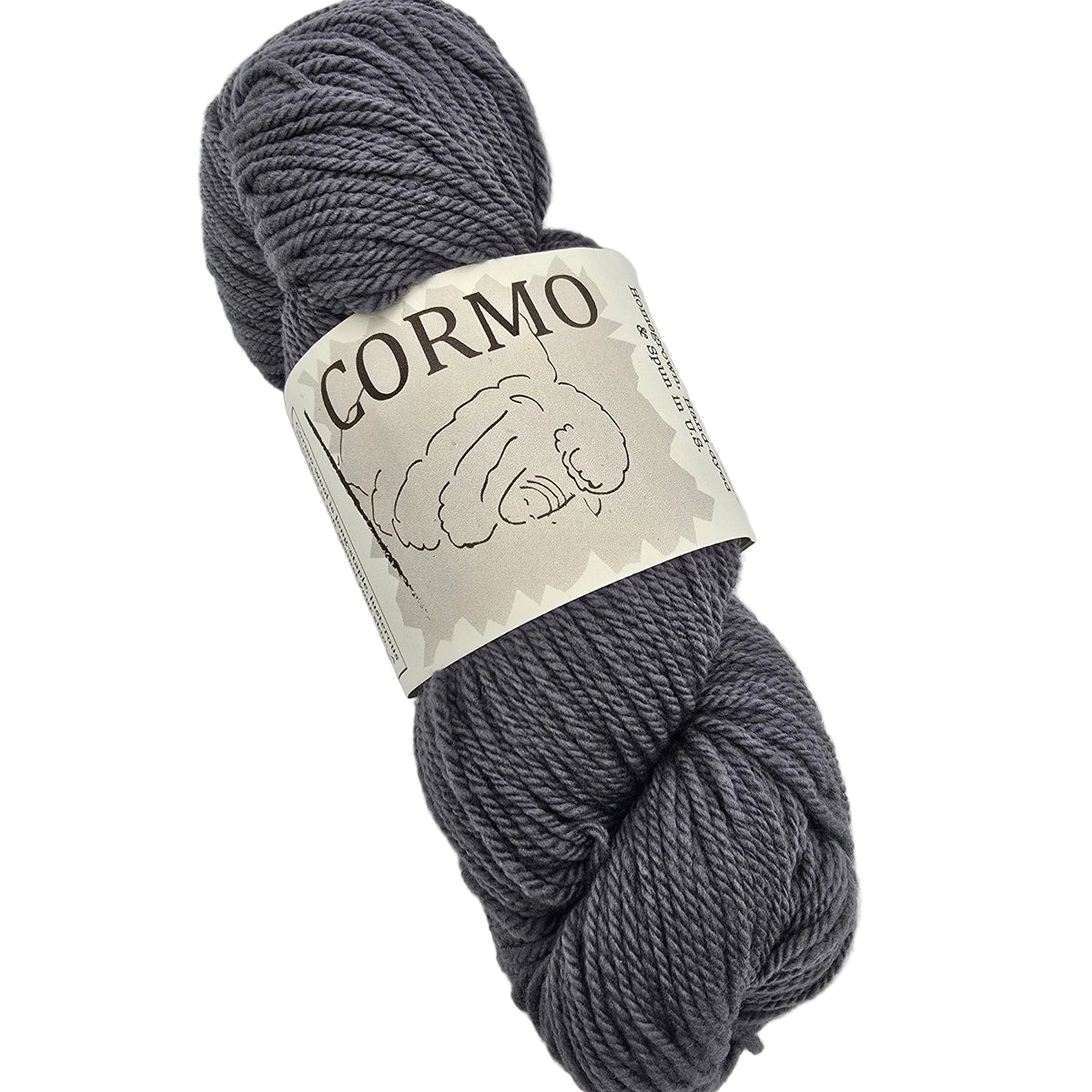 A skein of dark gray yarn with a paper label that reads 'CORMO' and shows a sheep illustration, photographed on a White background.