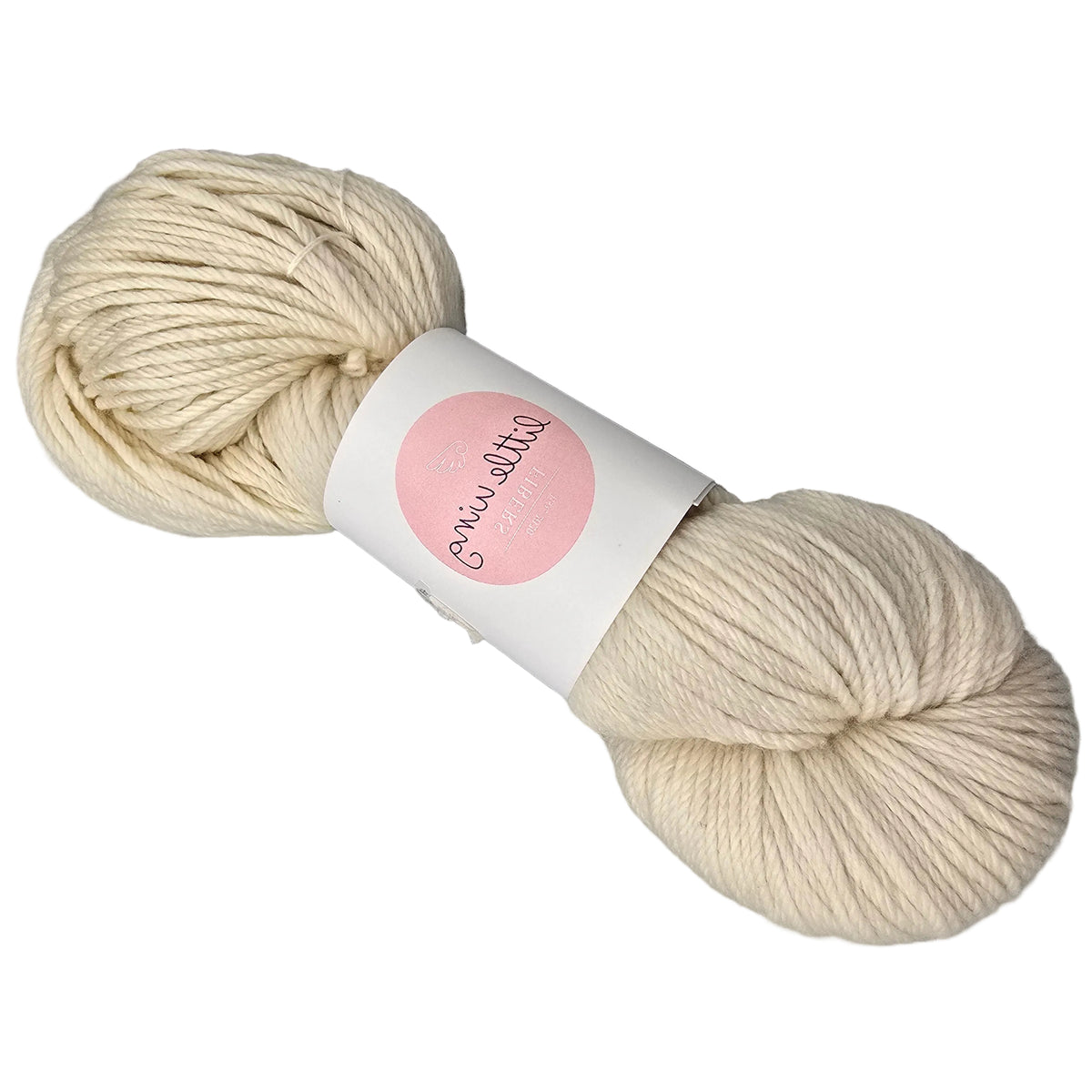 A skein of Featherlight_DK_yarn by_Little_Wing_Fibers in th color Pre-Bake a cream-colored yarn with a white paper label featuring a pink circle on a white background.
