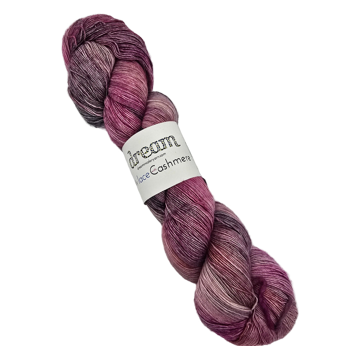 A single hank of Jilly Lace with Cashmere yarn by Dream in Color in the color Angelica, a variegated pink yarn with a white paper label on white background.