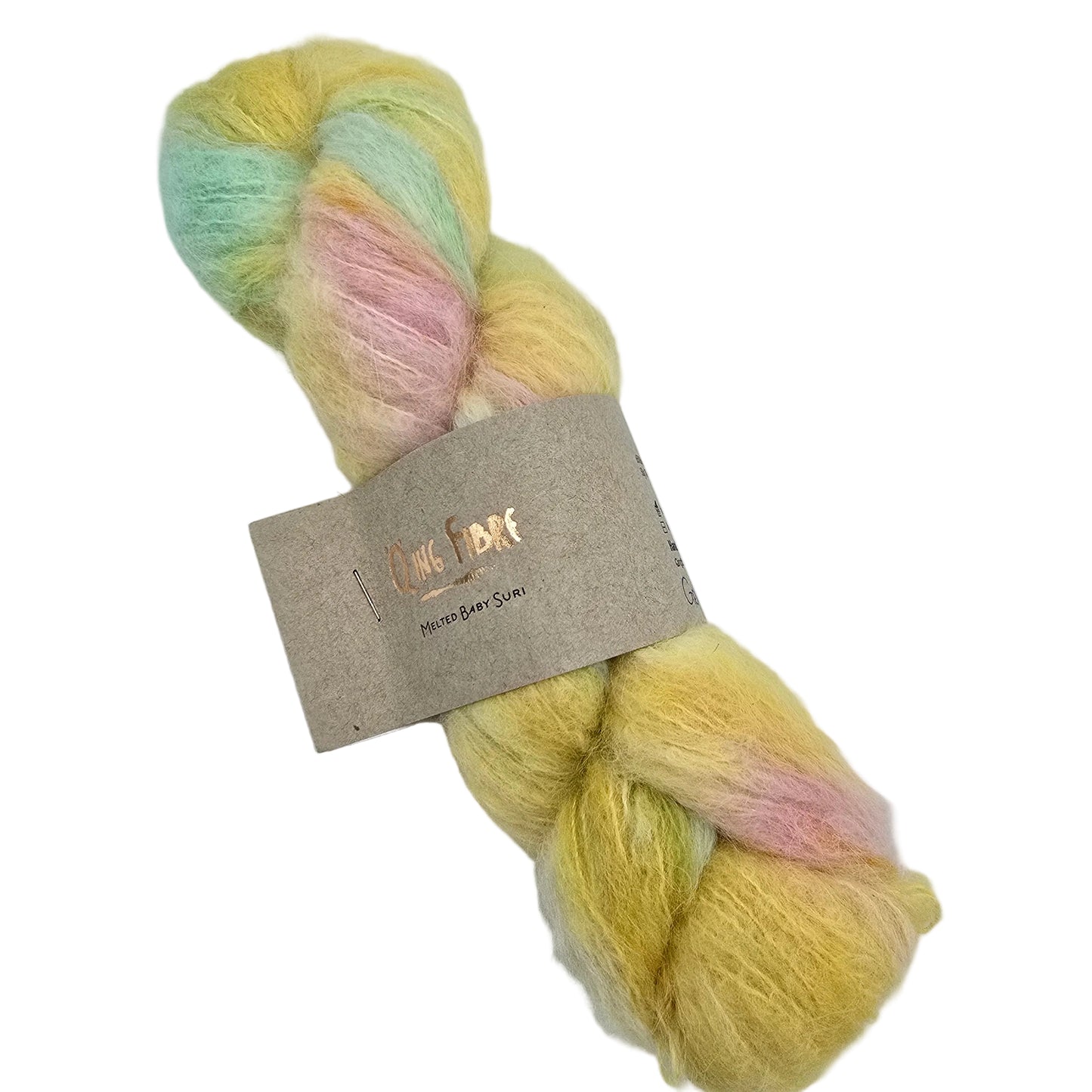 A skein of Melted Baby Suri yarn by Qing Fibre in the color Gelateria a pastel yellow, pink, and mint green, wrapped with a brown paper label on a white background.
