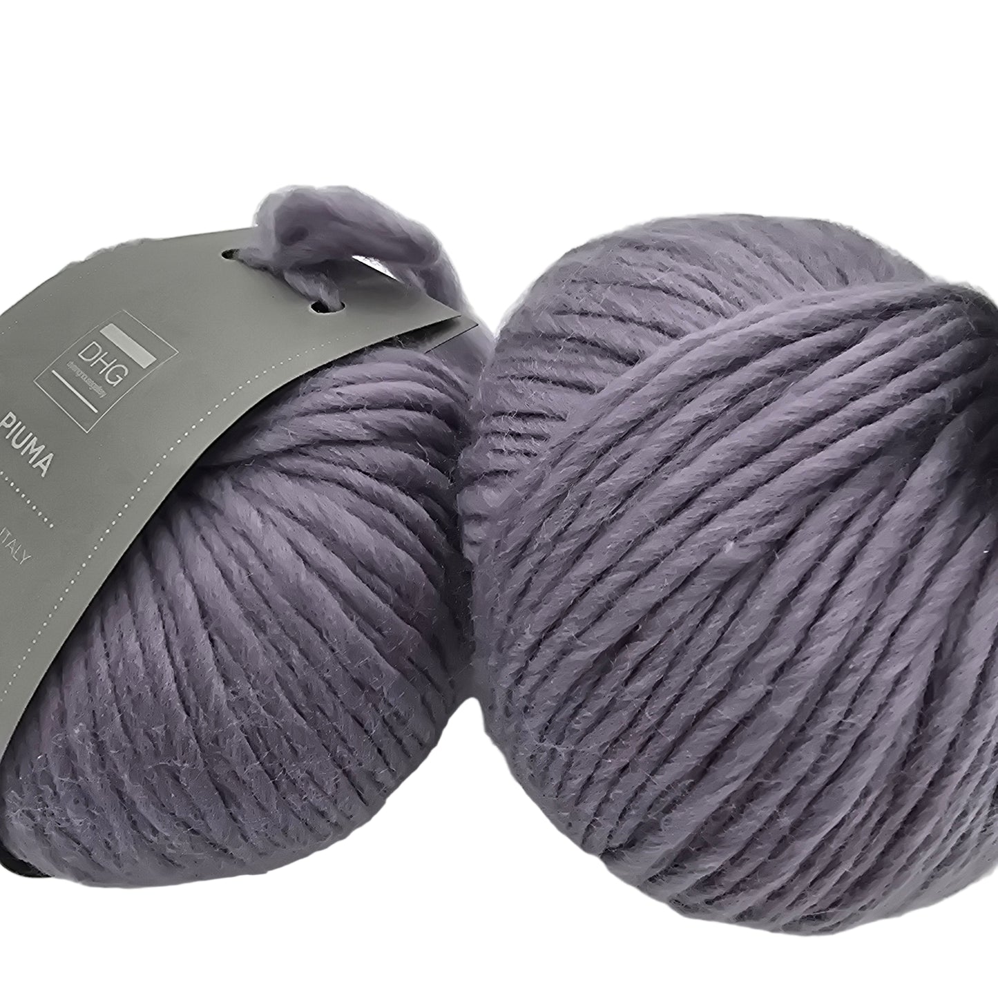 Image of two balls of Piuma by DHG Ultra Soft bulky Italian Merino Wool yarn in the color Fog which is a solid dusty purple with labels on a white background