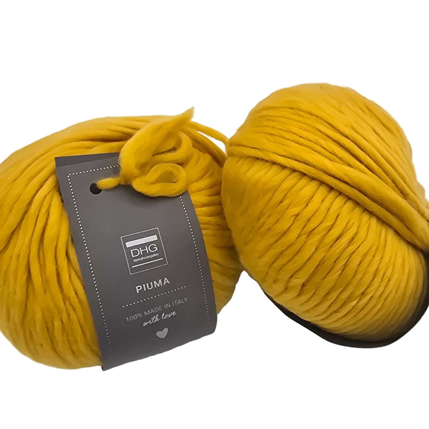 Image of two balls of Piuma by DHG Ultra Soft bulky Italian Merino Wool yarn in the color Saffron which is a solid deep yellow with labels on a white background