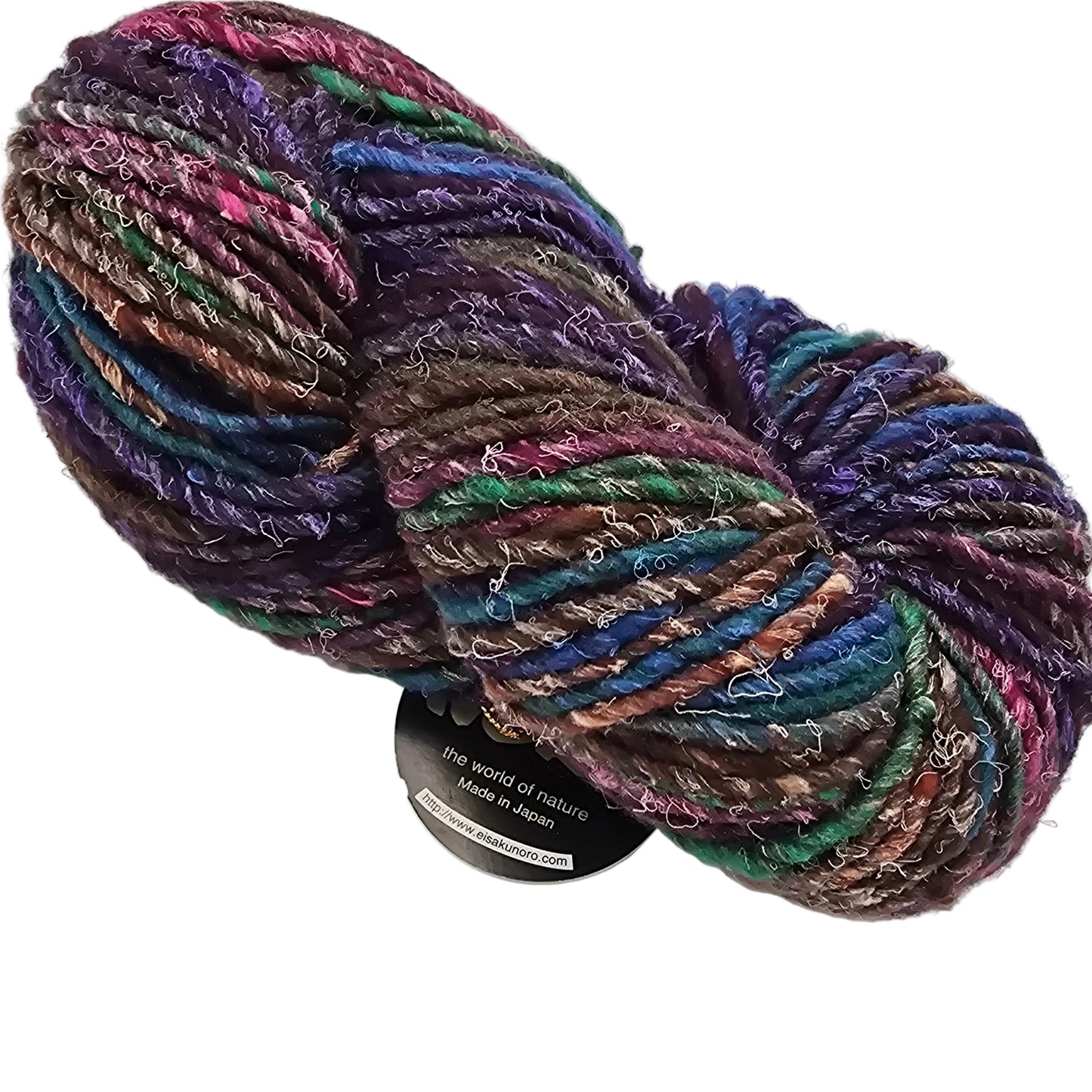 Image of a single skein of multicolor Iro by Noro Yarn in the color 16 with partial label showing on a white background.