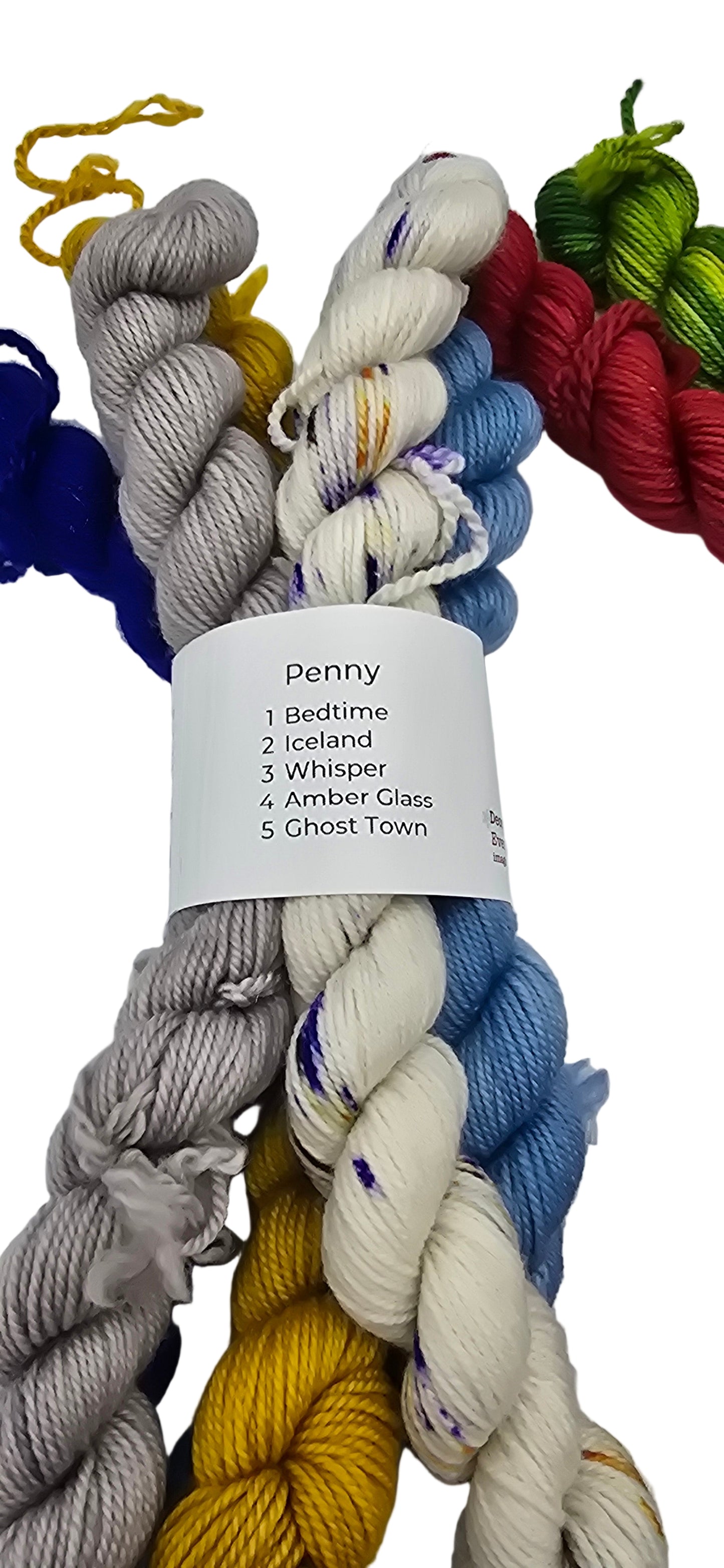 Image of multiple different colored mini skeins of Smooshy Cashmere by Dream yarn in a color package named Penny with label on white background.