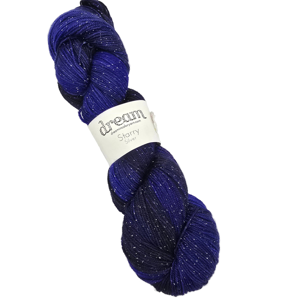 A skein of Starry_Yarn_by_Dream_in_Color featuring a deep blue and purple gradient with fine silver glitter fibers, wrapped in a white paper band on a white background.