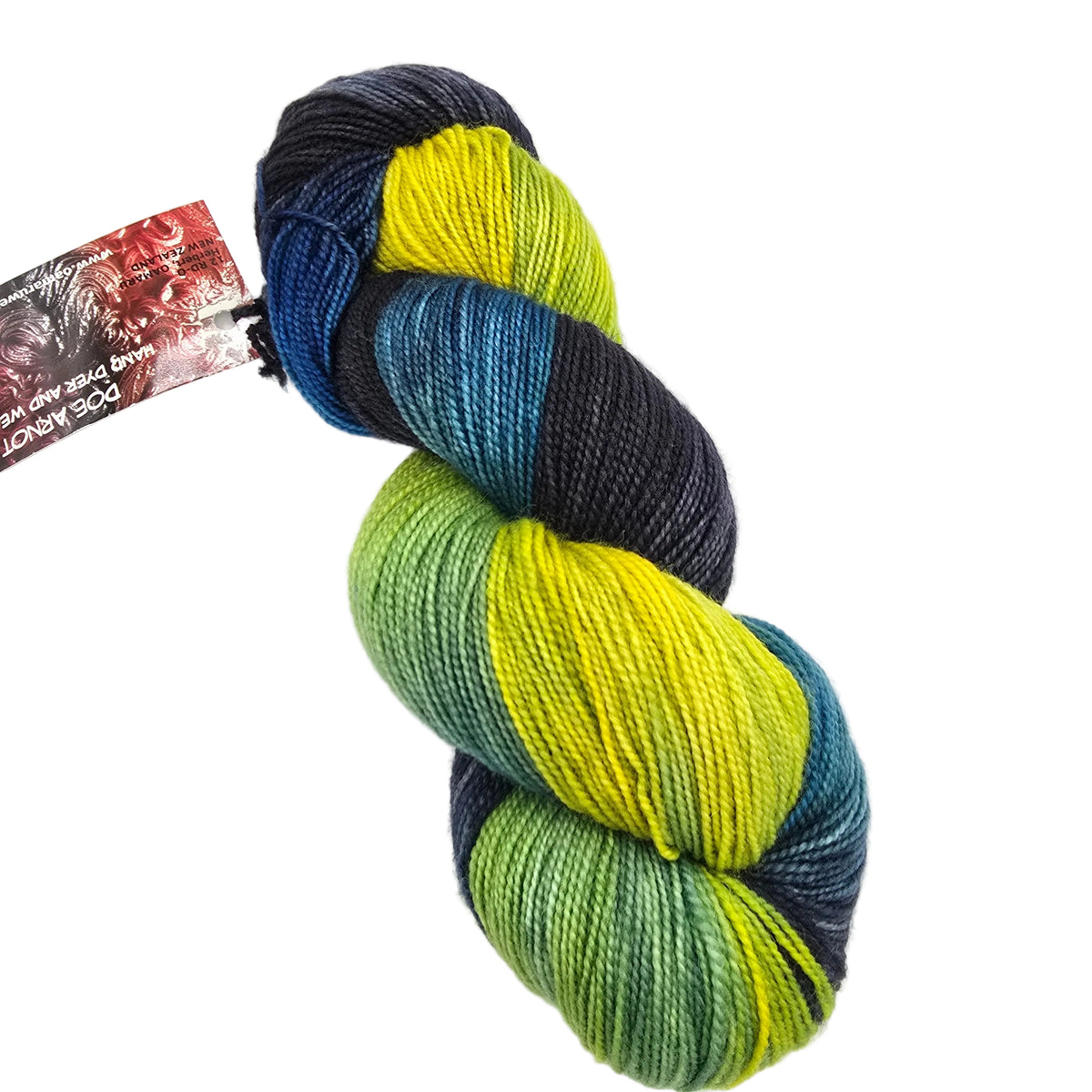 A single skein of variegated yarn with a paper tag attached, photographed on a plain white background. The yarn shows color-shifting bands of dark navy, bright yellow, teal-blue, and olive green.