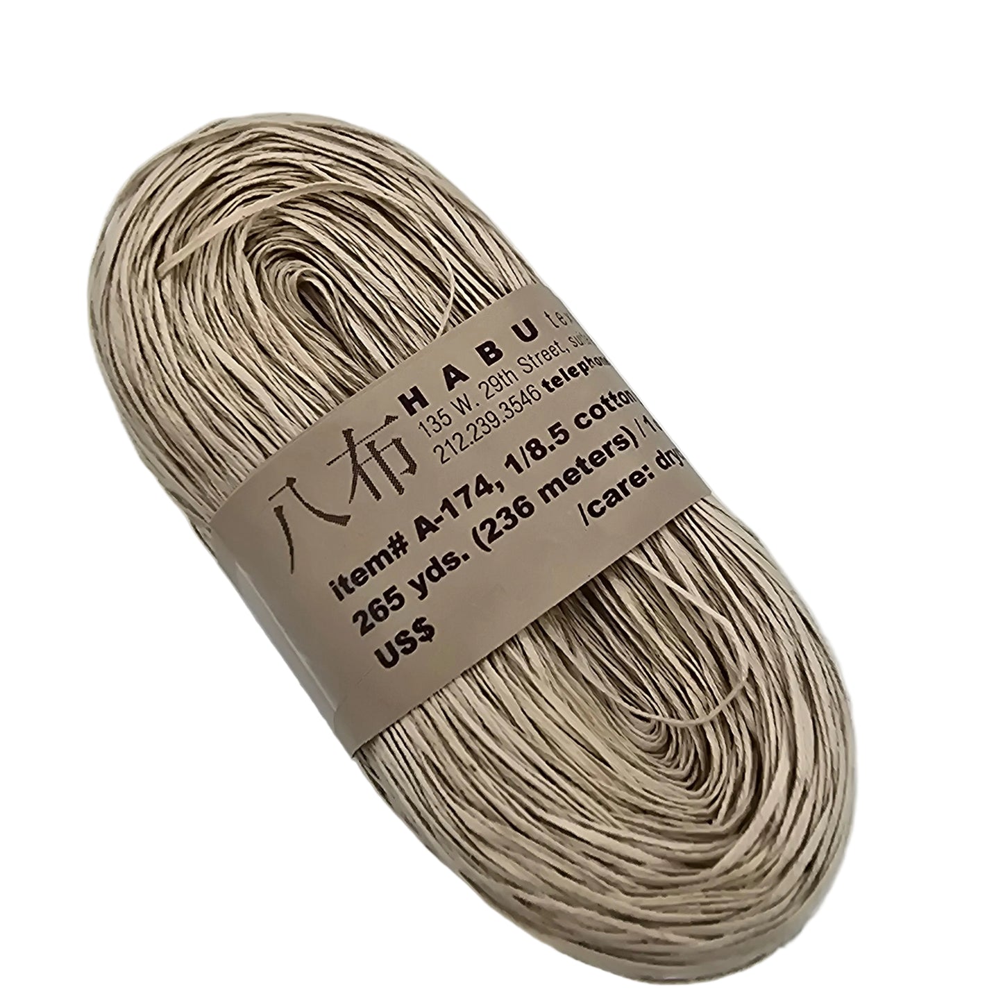 Image of a single hank of A-174 1/8.5 Cotton Gima yarn by Habu Textiles in color 12 with label on a white background.