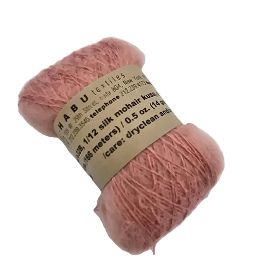 Image of a single Hank of A-32B Silk Mohair, Kusa Yarn by Habu Textiles in Color 32 with label on a white background.