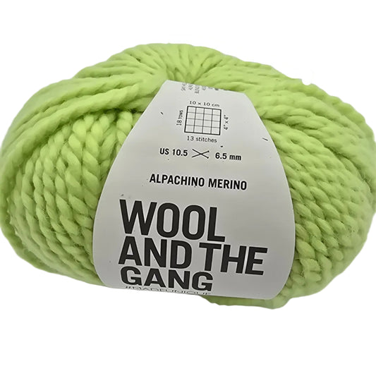 Image of a single ball of Alpachino Merino Yarn by Wool And The Gang Lime Sorbet with label on a white background.