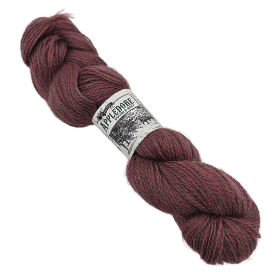 Image of a single skein of Appledore DK yarn by John Arbon Textiles  in the color Sweet Coppin with label on a white background.