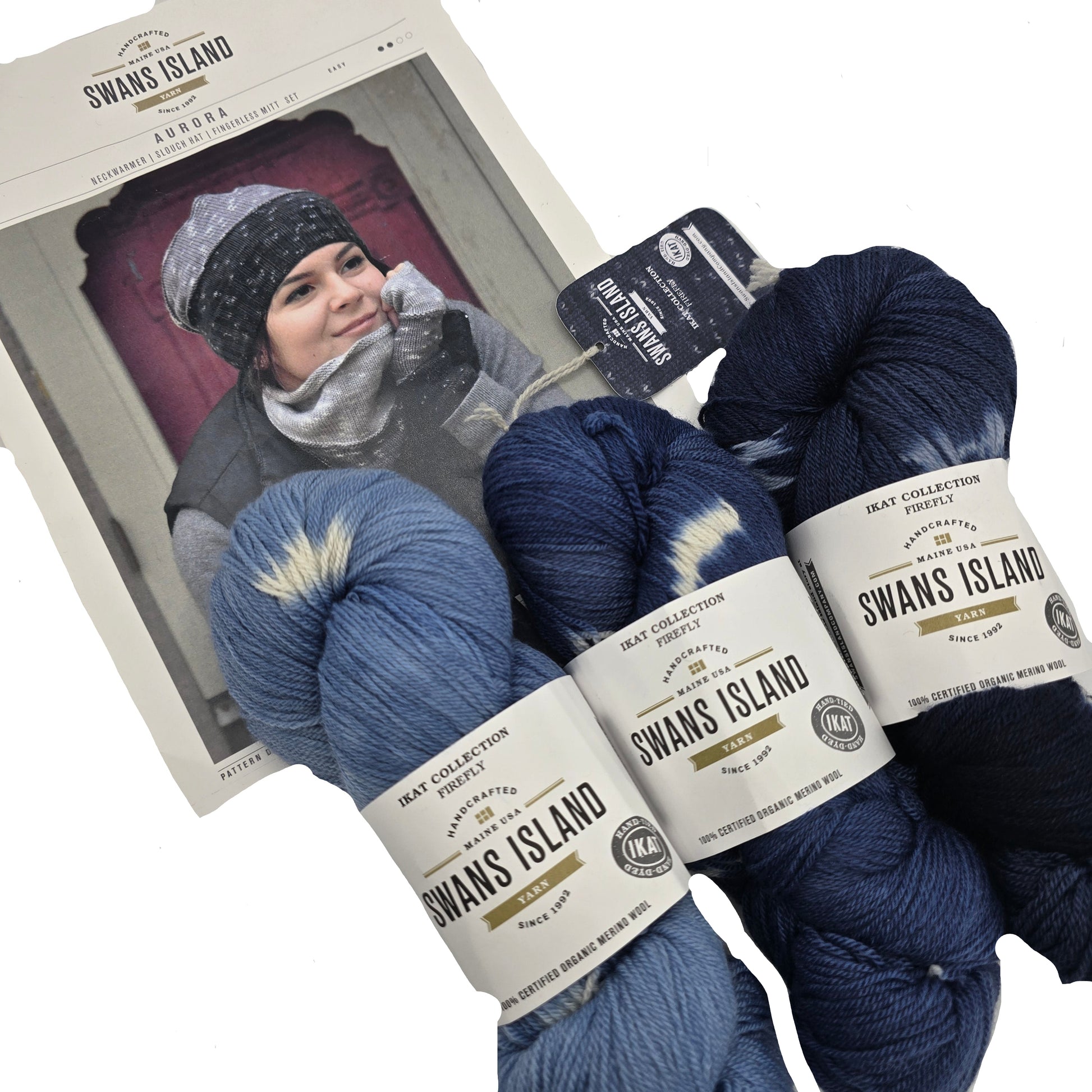 Image of three skeins of yarn and instruction booklet on a white background.