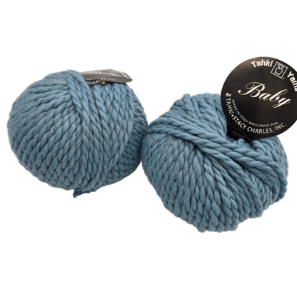 Image of two balls of Baby by Tahki yarn color 39 with labels on a white background.