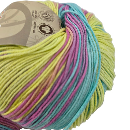 Close-up image of a partial ball of Bio Bimbo by Sesia yarn Color 5047 Sunny Day with label on a white background.