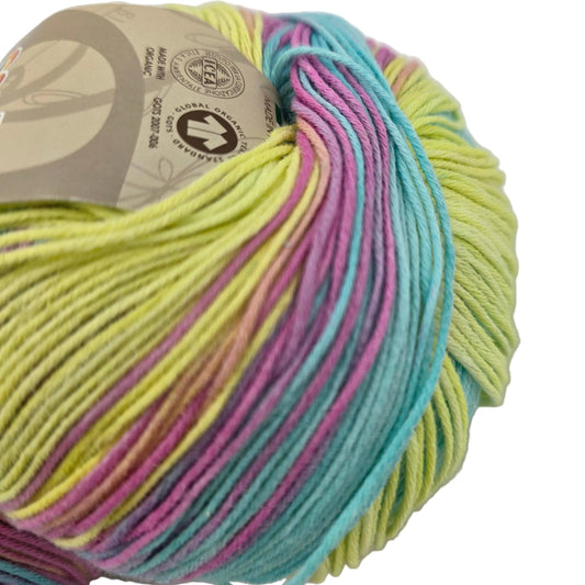Close-up image of a partial ball of Bio Bimbo by Sesia yarn Color 5047 Sunny Day with label on a white background.