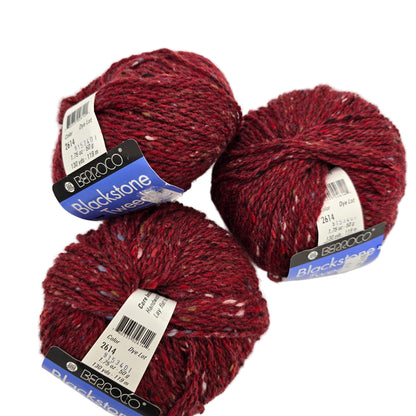 Image of three balls of Blackstone Tweed by Berroco in Color 2614 with labels on a white background.
