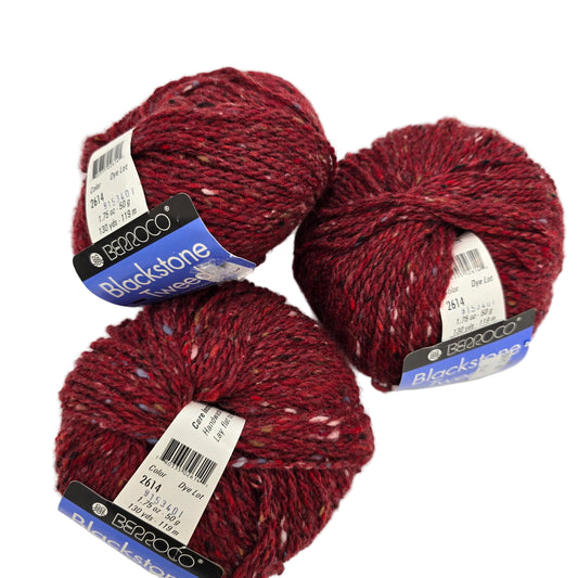 Image of three balls of Blackstone Tweed by Berroco in Color 2614 with labels on a white background.