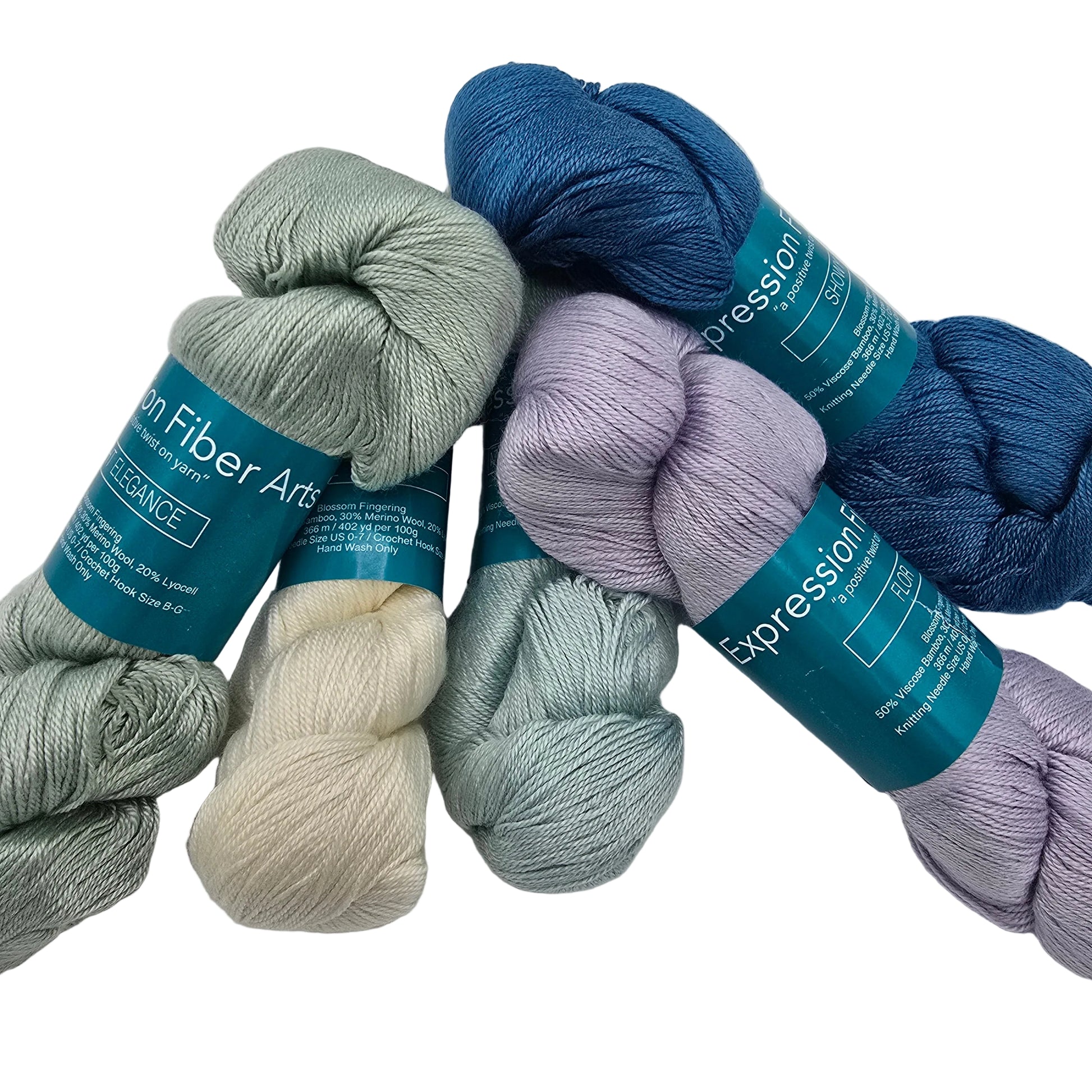 Five skeins of yarn in muted blue, sage green, cream, light blue, and lavender purple, arranged on a white background. Each skein has a teal paper label that reads 'Expression' and 'Yarn Fiber Arts'.