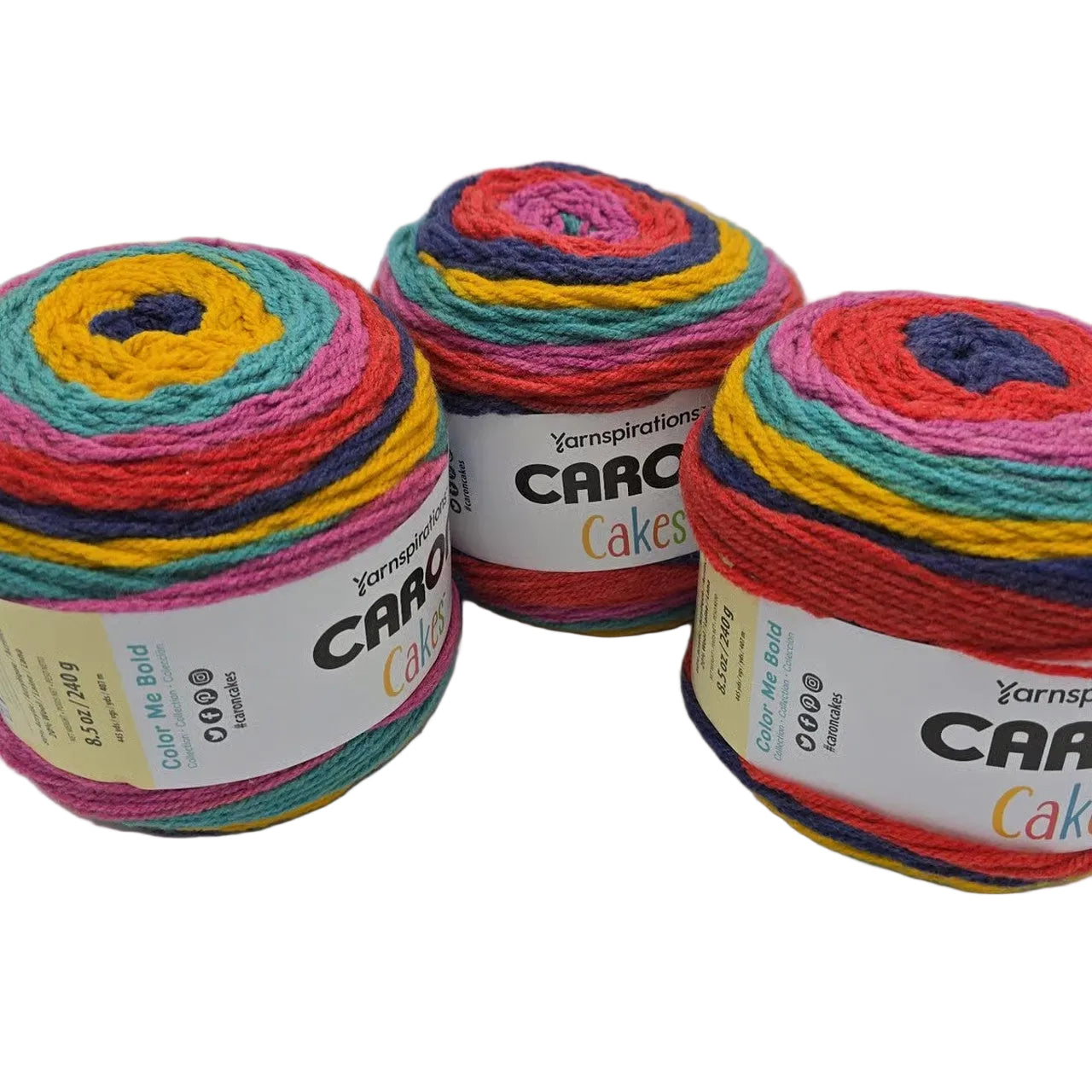 Image of 3 Caron Cakes of Yarn in the color Fruit Frosting with labels on a white background.