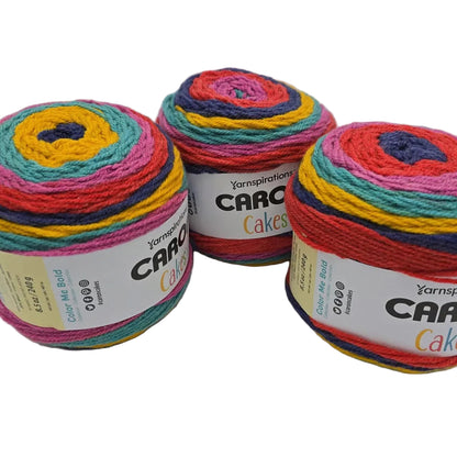 Image of 3 Caron Cakes of Yarn in the color Fruit Frosting with labels on a white background.