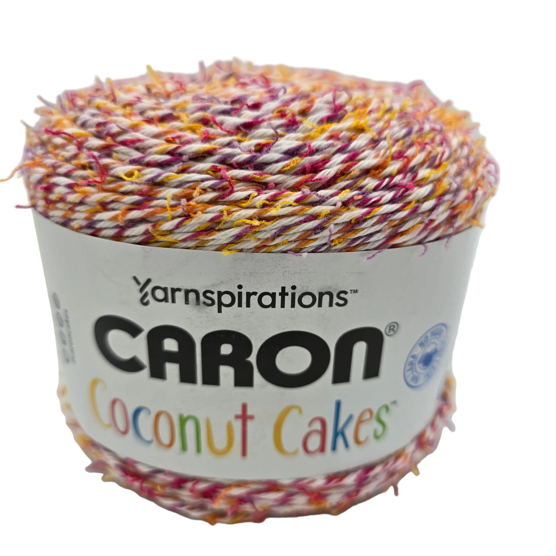 Image of a single cake of Caron Coconut Cakes yarn in the color Tutti Frutti with label on a white background.