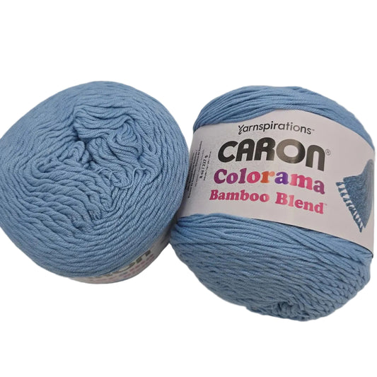image of two cakes of Caron Colorama Bamboo Blend yarn in the color Clear Sky with labels on a white background.