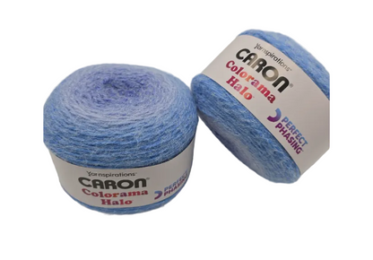 Image of two cakes of Caron Colorama Halo Perfect Phasing yarn in the color Ultra Marine  with labels on a white background.