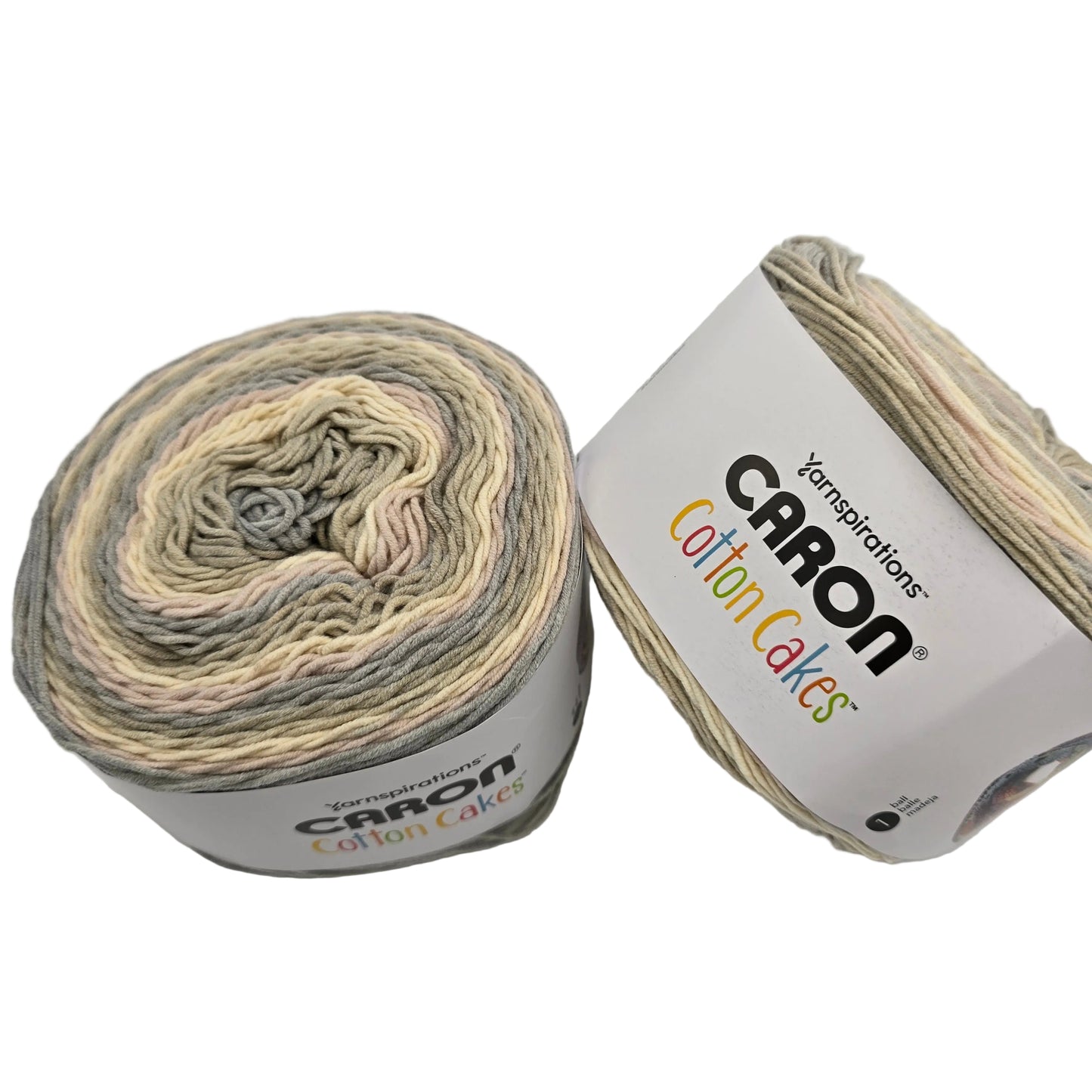 Image two cakes of Caron Cotton Cakes Yarn in the color lighthouse with labels on a white background.