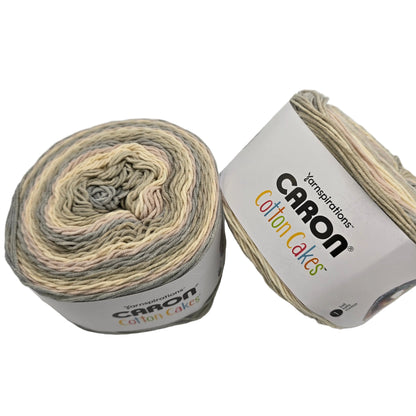 Image two cakes of Caron Cotton Cakes Yarn in the color lighthouse with labels on a white background.