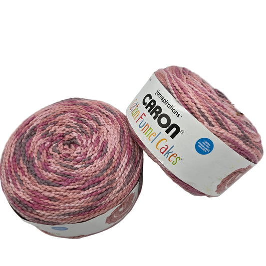 Image of two Caron Cotton Funnel Cakes of yarn in the color Rose Petal with labels on a white background.
