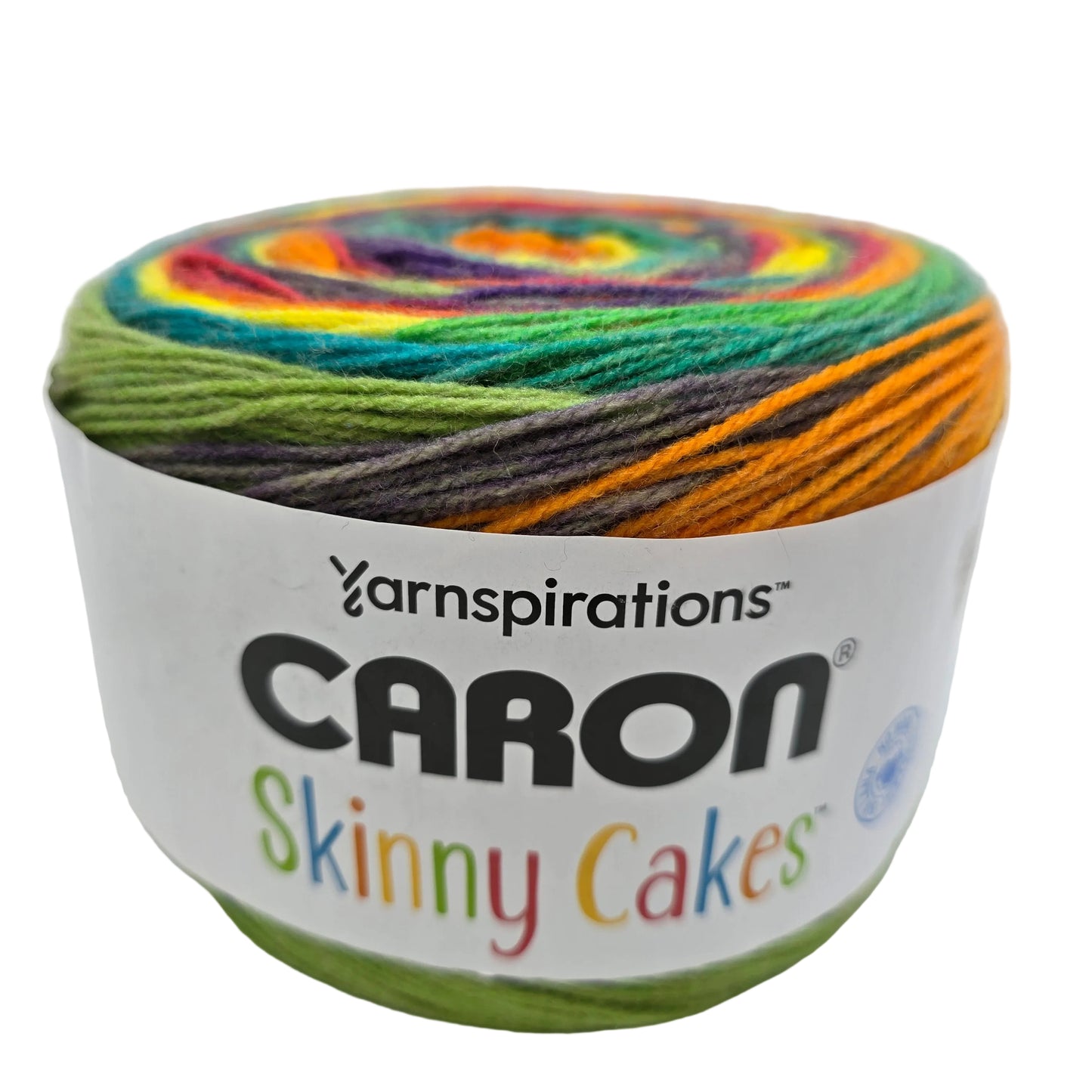 Image of a single skein of Caron Skinny Cakes yarn in the color Rainbow with label on a white background.