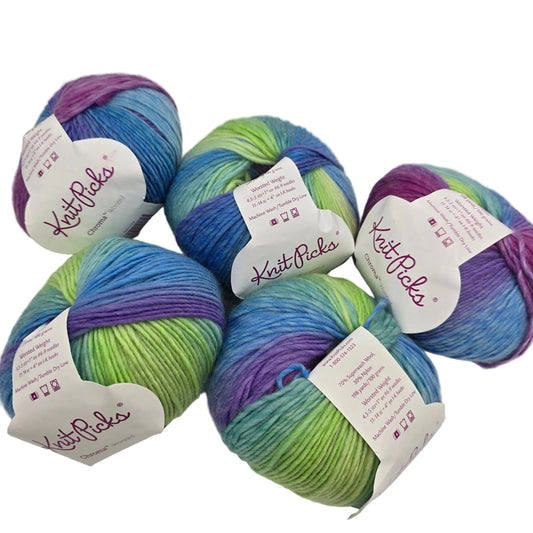Image of 5 balls of Chroma Worsted yarn by Knit Picks in the color Pegasus with labels on white background.