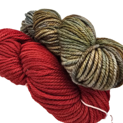 Two skeins of twisted yarn on a white background, one in deep red and one in variegated olive green, tan, and brown tones.