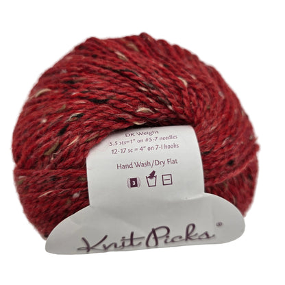 Image of a single ball of City Tweed DK yarn by Knit Picks in the color Romance with a label on a white background.