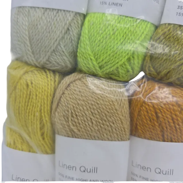Close-up Image of a set of mini skeins of Purl Soho Linen Quill Yarn Set of 10 Minis in Citrus & Brown colors with labels on a white background.