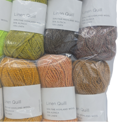 Close-up Image of a set of mini skeins of Purl Soho Linen Quill Yarn Set of 10 Minis in Citrus & Brown colors with labels on a white background.