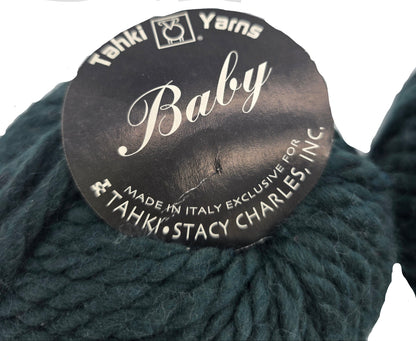 Close-up image of Baby Yarn by Tahki in Color 4 with label on a white background.