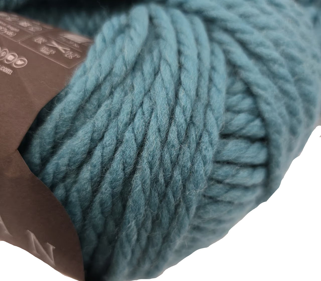 Close-up image of Big Wool Yarn By Rowan  in the color 054 Vert with partial label on a white background.
