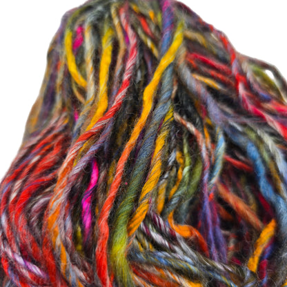 Close-up image of Boboli by Berroco yarn in Color 5352 Red Multi on a white background.