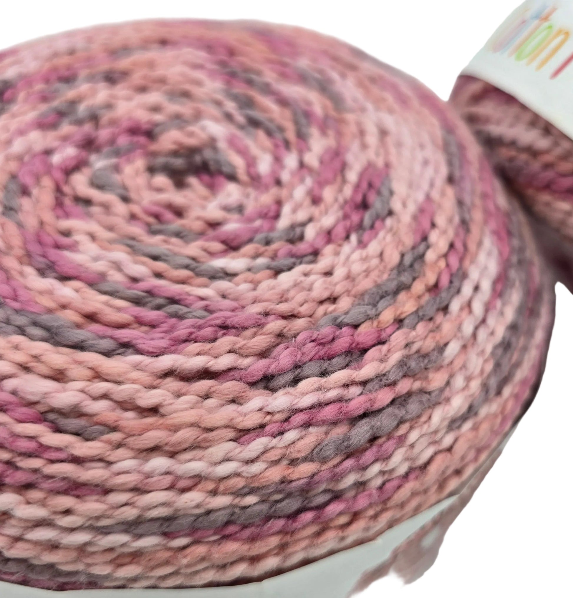 Close-up image of Caron Cotton Funnel Cakes Yarn in the color  Rose Petal on a white background.