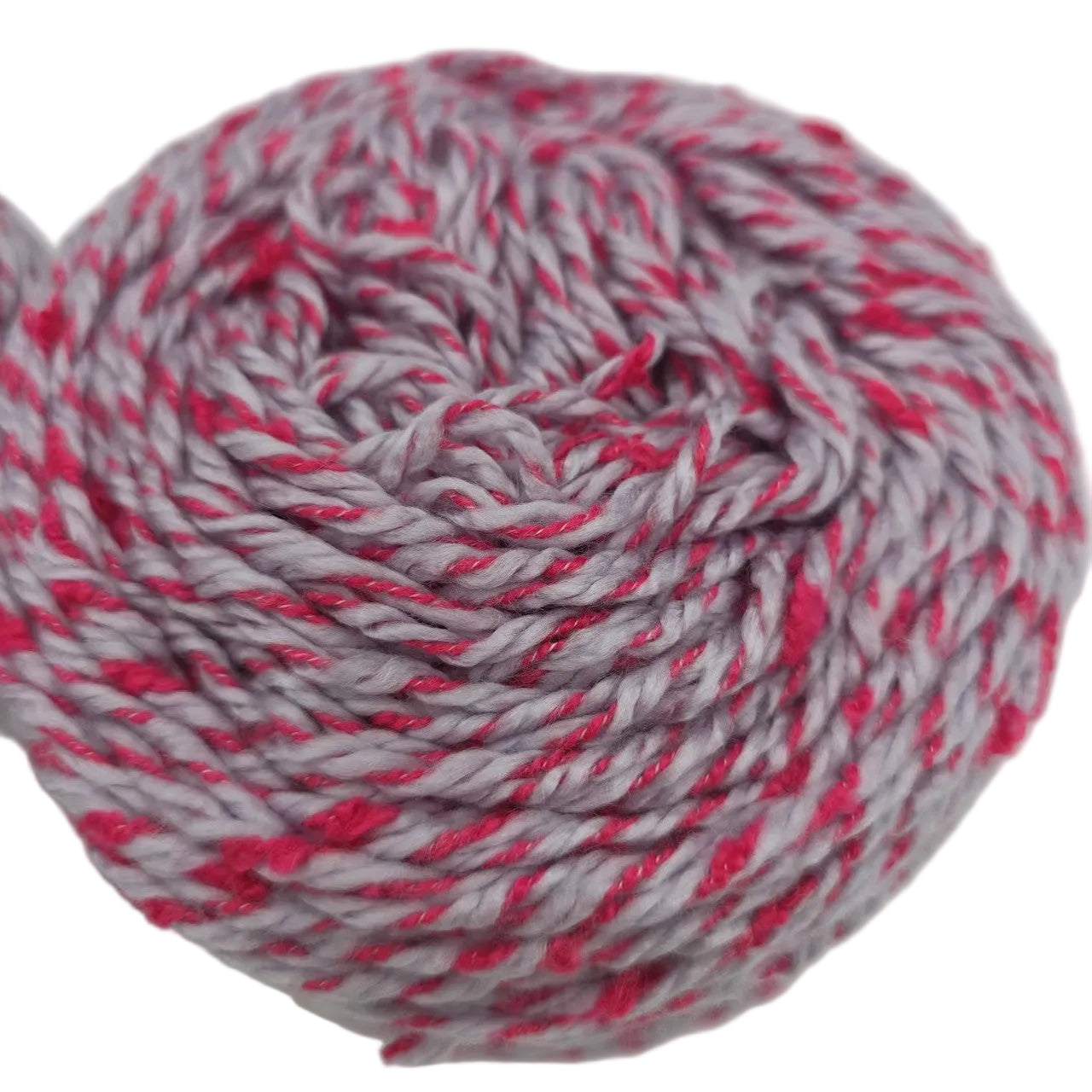 Close-up image of a single Caron Funfetti Yarn Cake in the color Orchid Pop a white background.